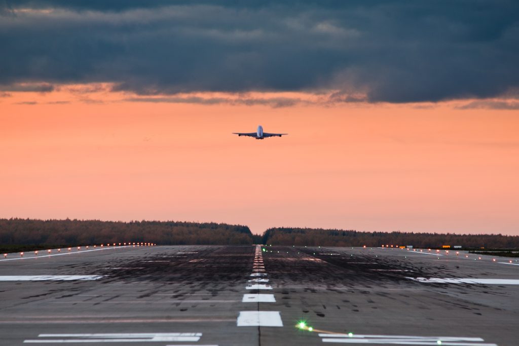 a strip of ground set aside for the takeoff and landing of aircraft.