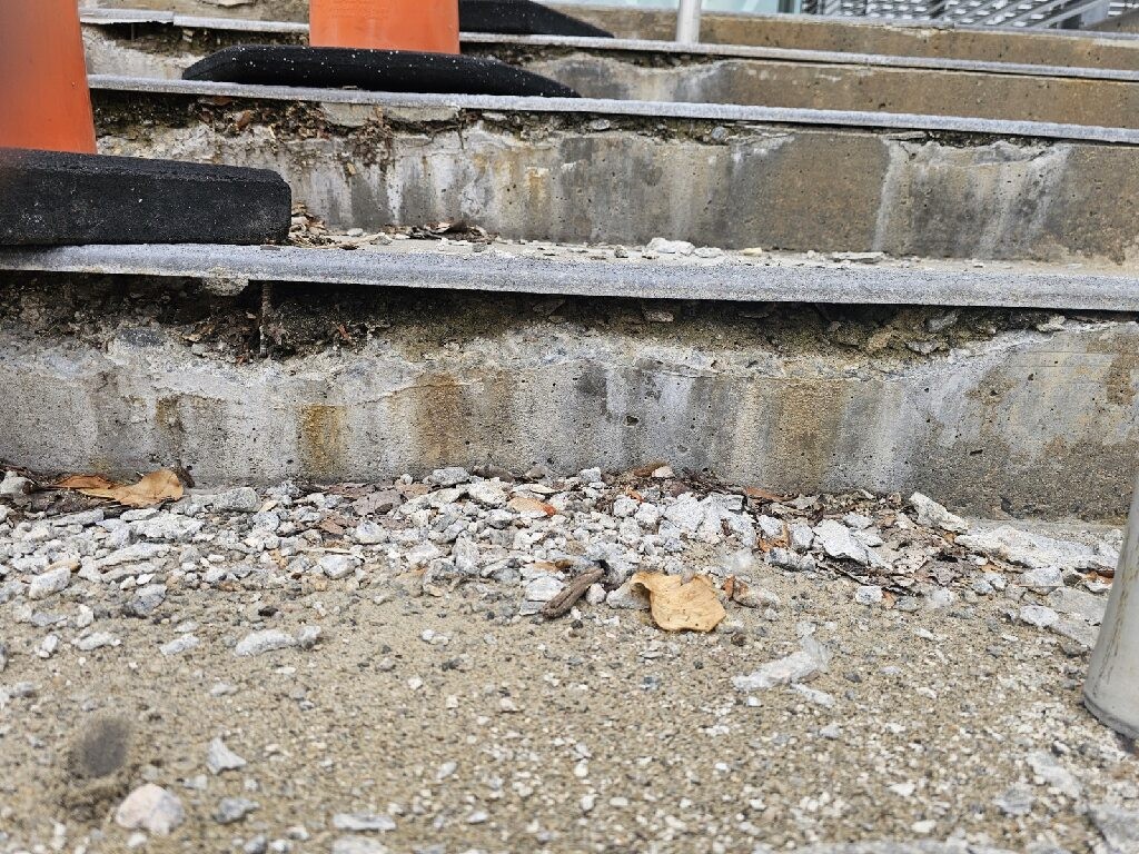 The combined chemical and physical attack gradually erodes the concrete.